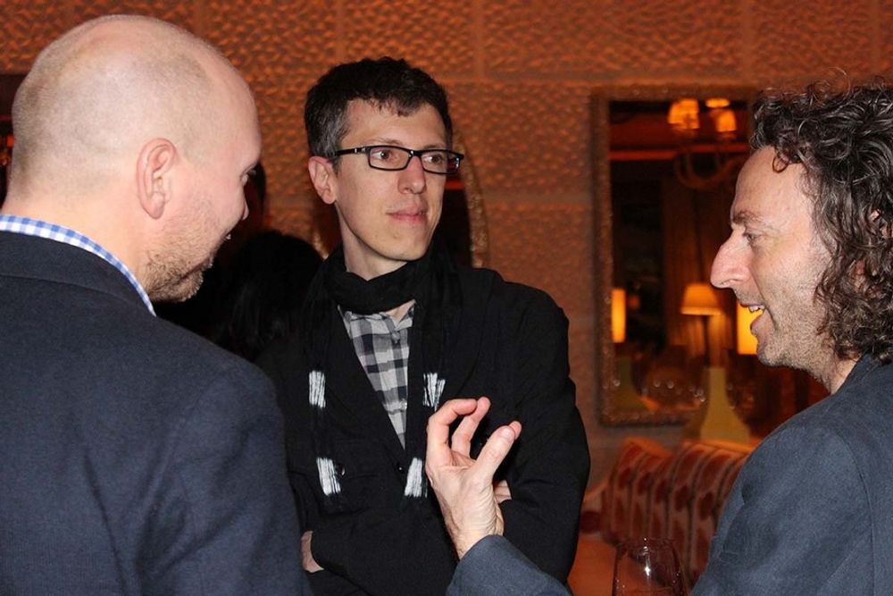 Philip Ahlqwist, Christian Haas, and John Mescall immersed in conversation
