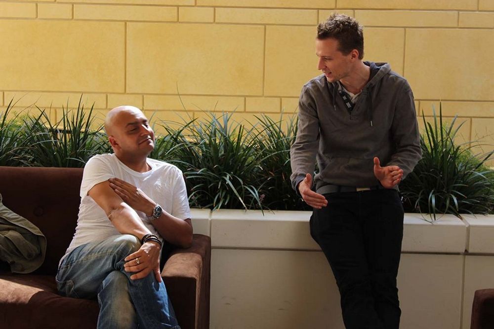 Amir Kassaei and Michael Haas having a great time conversing on the patio