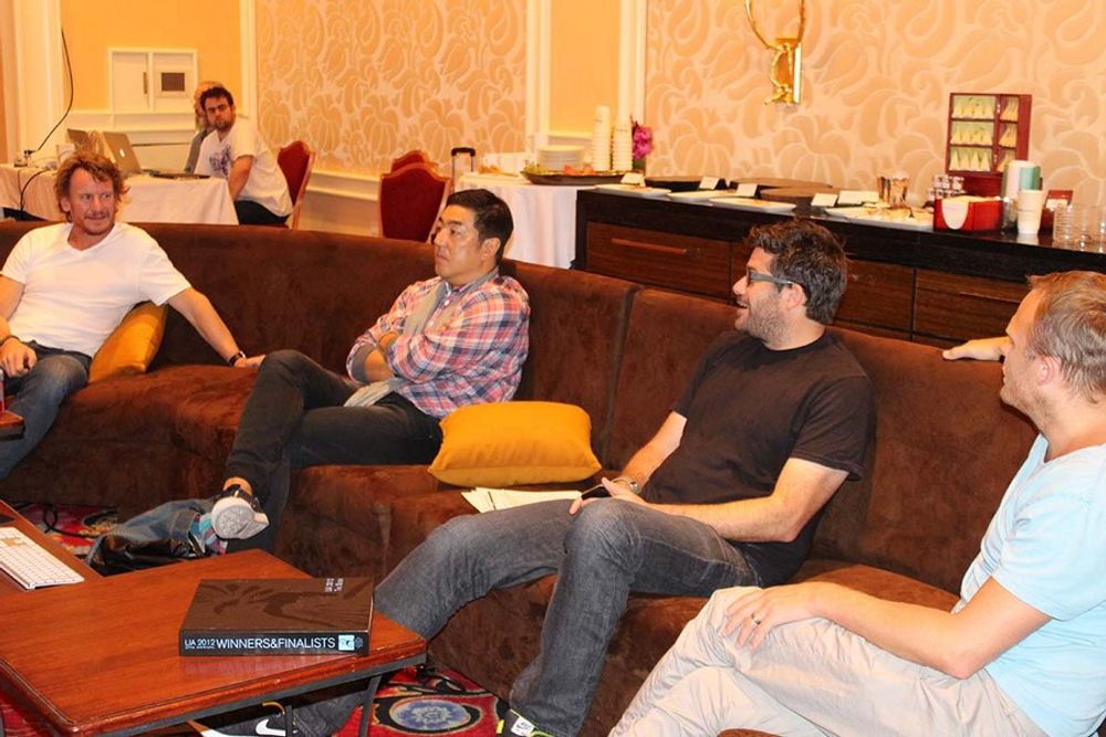Nick Law, Naoki Ito, Brendan DiBona, and Andreas Ullenius mingling in the judging room