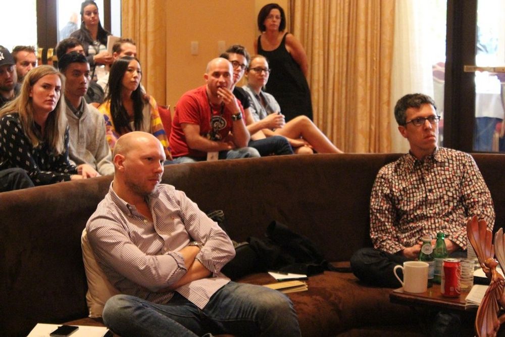 Philip Ahlqwist and Christian Haas enjoy statue discussions, while young creatives sit in