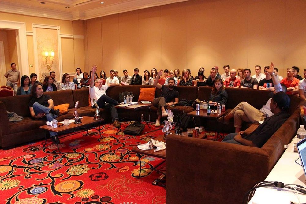 TV/Cinema/Online Film - Music & Sound Jury in the judging room with a group of young creatives sitting in on their statue discussions