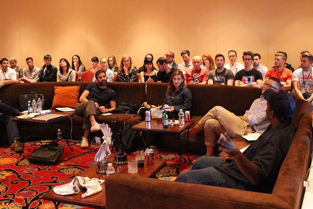 The TV/Cinema/Online Film - Music & Sound Jury enjoying their time in the judging room with young creatives sitting in on their statue discussions