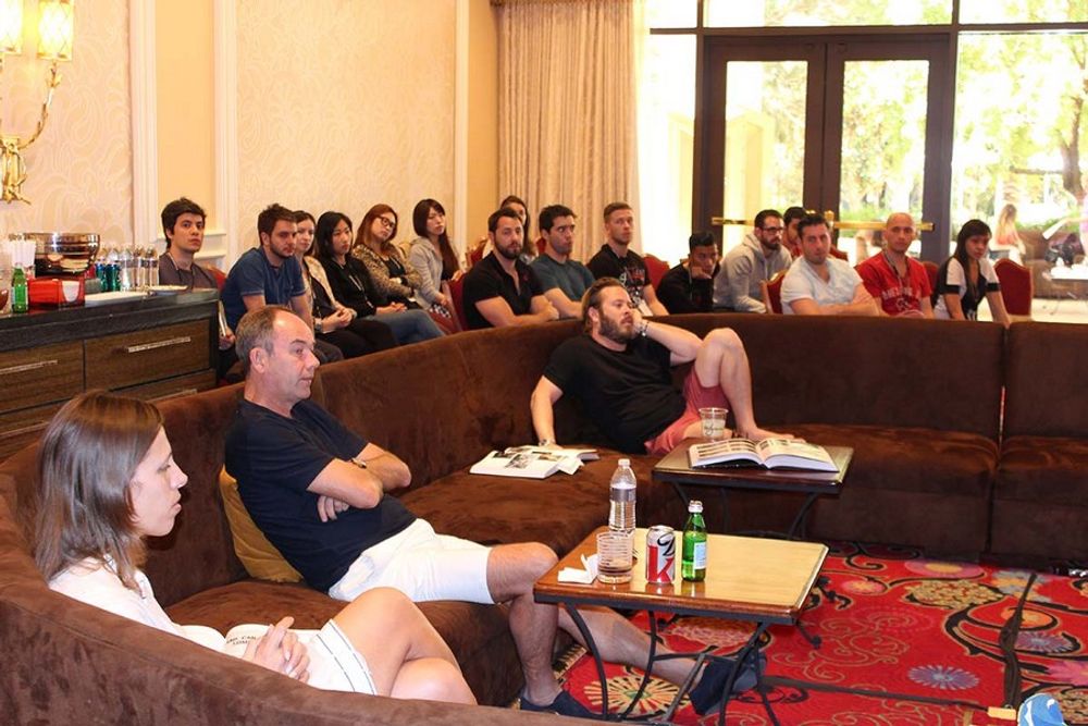 Hadas Liwer, Jeremy Craigen and Matty Burton enjoying discussions while young creatives sit in