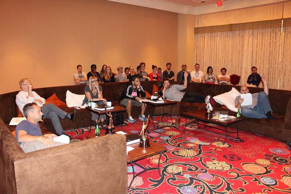 The TV/Cinema/Online Film - Production | Post-Production Jury enjoying statue discussions, while the young creatives sit in