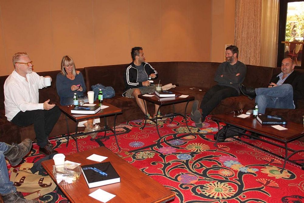 Jonathon Ker, Laura Gregory, Roopak Saluja, George Mackenzie, and John Spary mingling in the judging room.