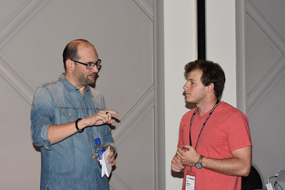 Chris Smith engaging in conversation with young creative Johnny Michael