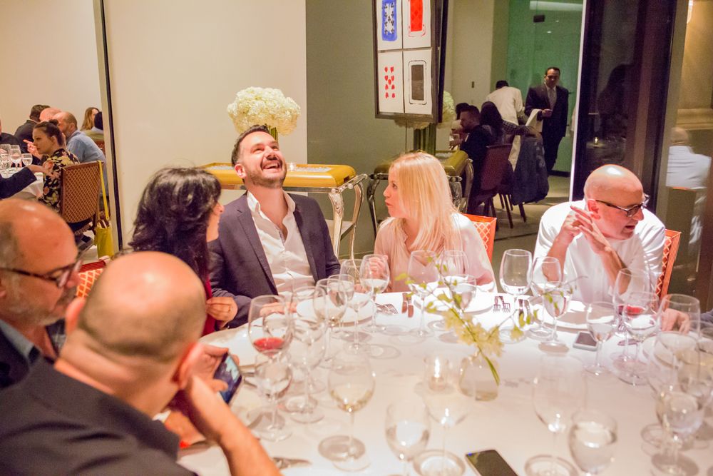 Anna Fawcett, Adrian Bosich and Chloe Gotlieb enjoying dinner