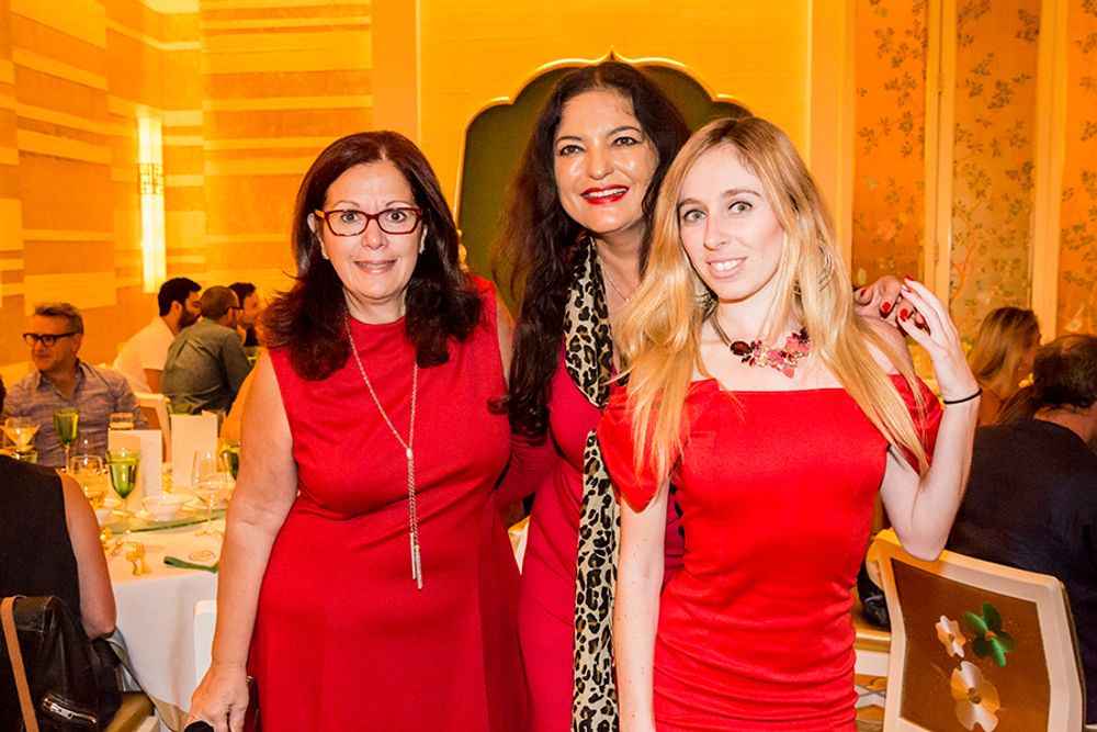 Patricia Censoprano, Doerte Spengler-Ahrens and Laurissa Levy dressed in red at Wing Lei