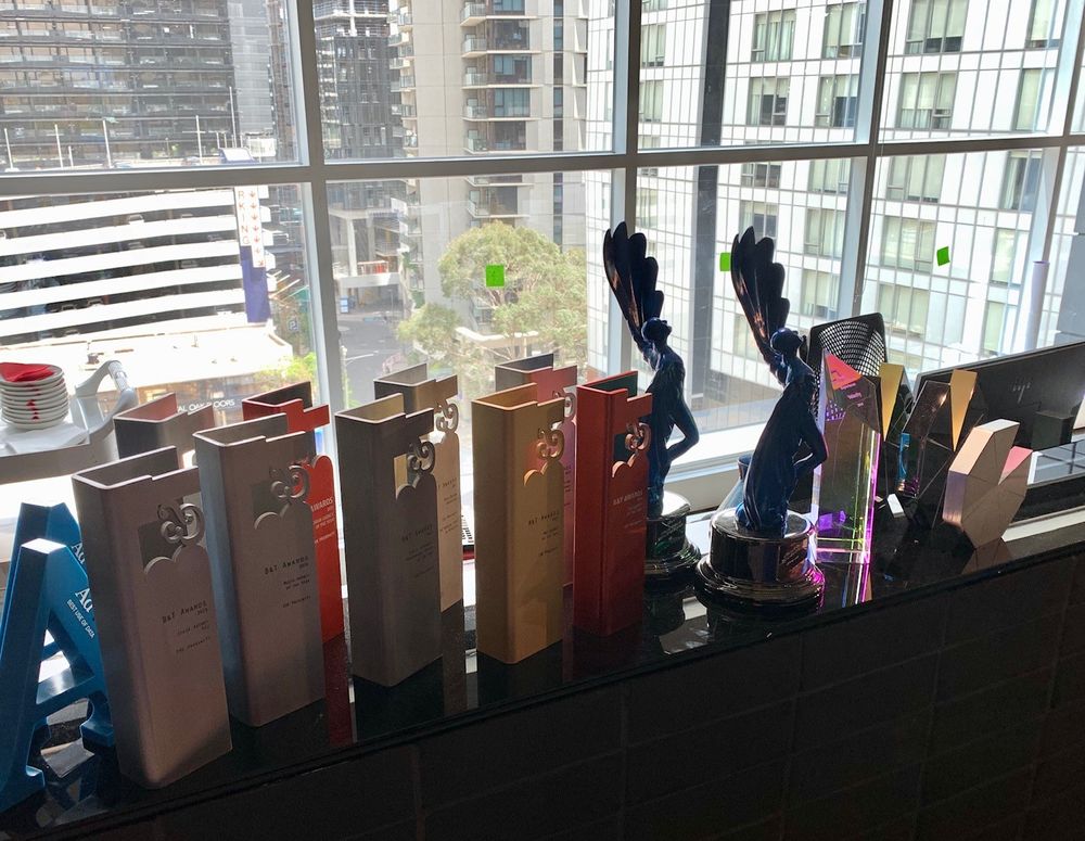 CHE Proximity Australia displays the beautiful blue LIA they were awarded for Regional Agency Of The Year for Australia & New Zealand