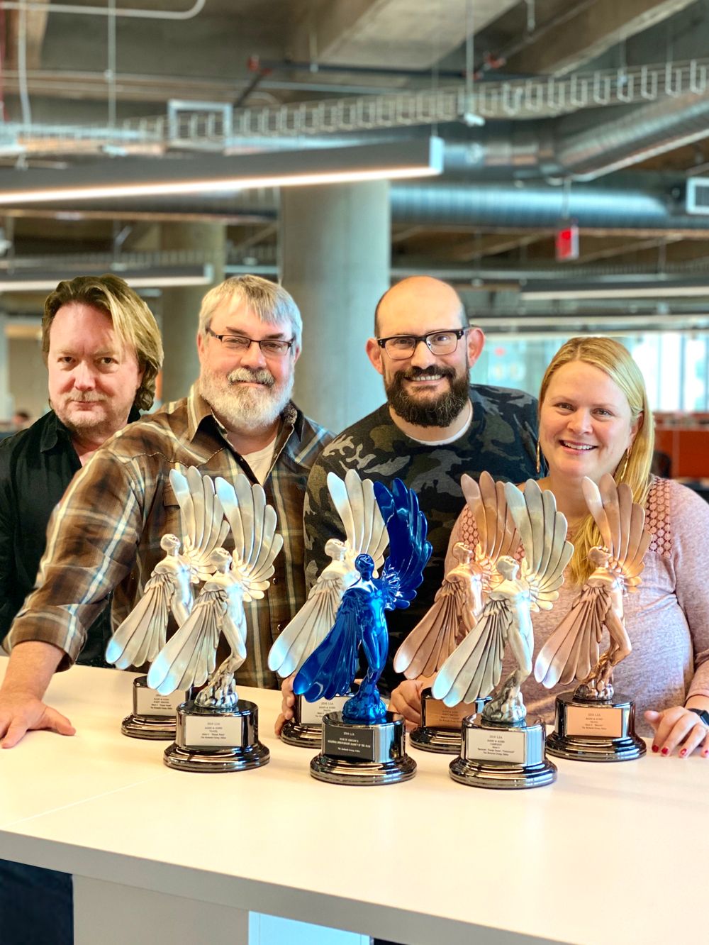 The Richards Group proudly display their Statues, pictured Wendy Mayes, Chris Smith, Bo McCord, and Stuart Hill